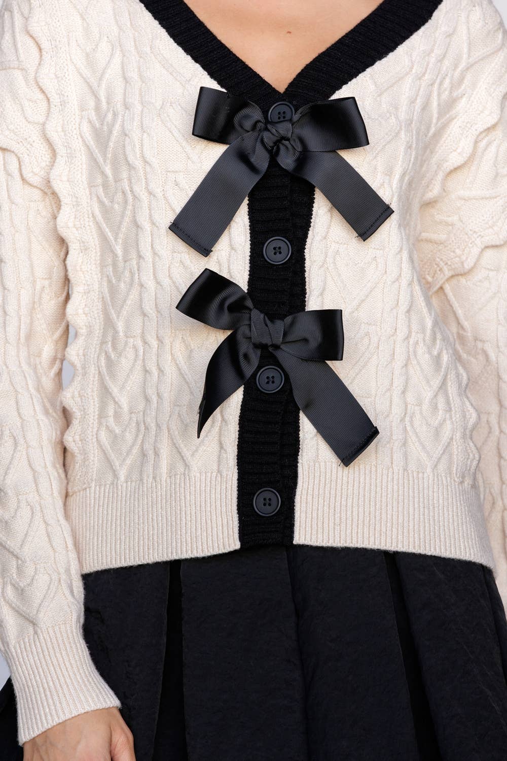 CABLE KNIT CARDIGAN WITH BOWS