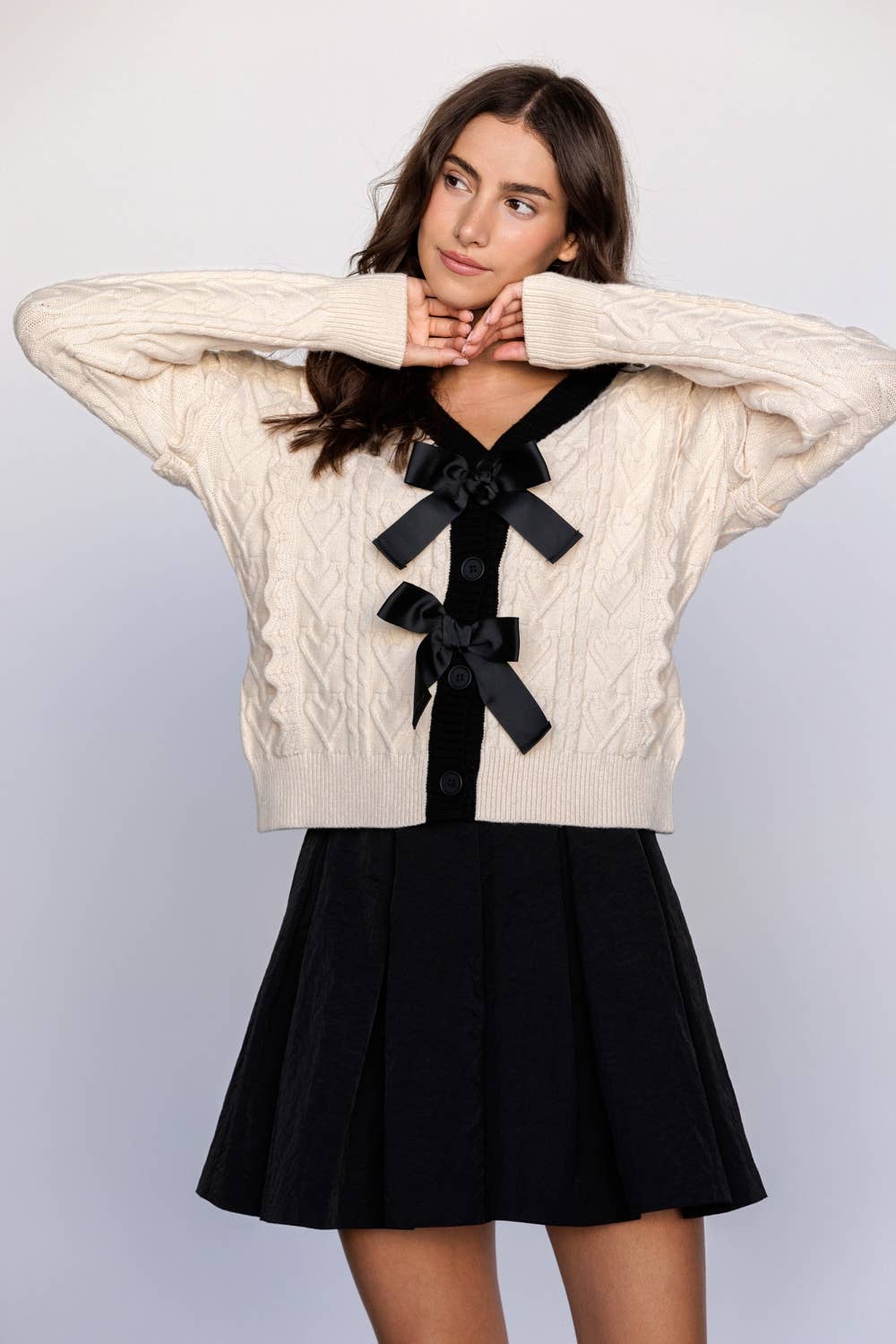 CABLE KNIT CARDIGAN WITH BOWS