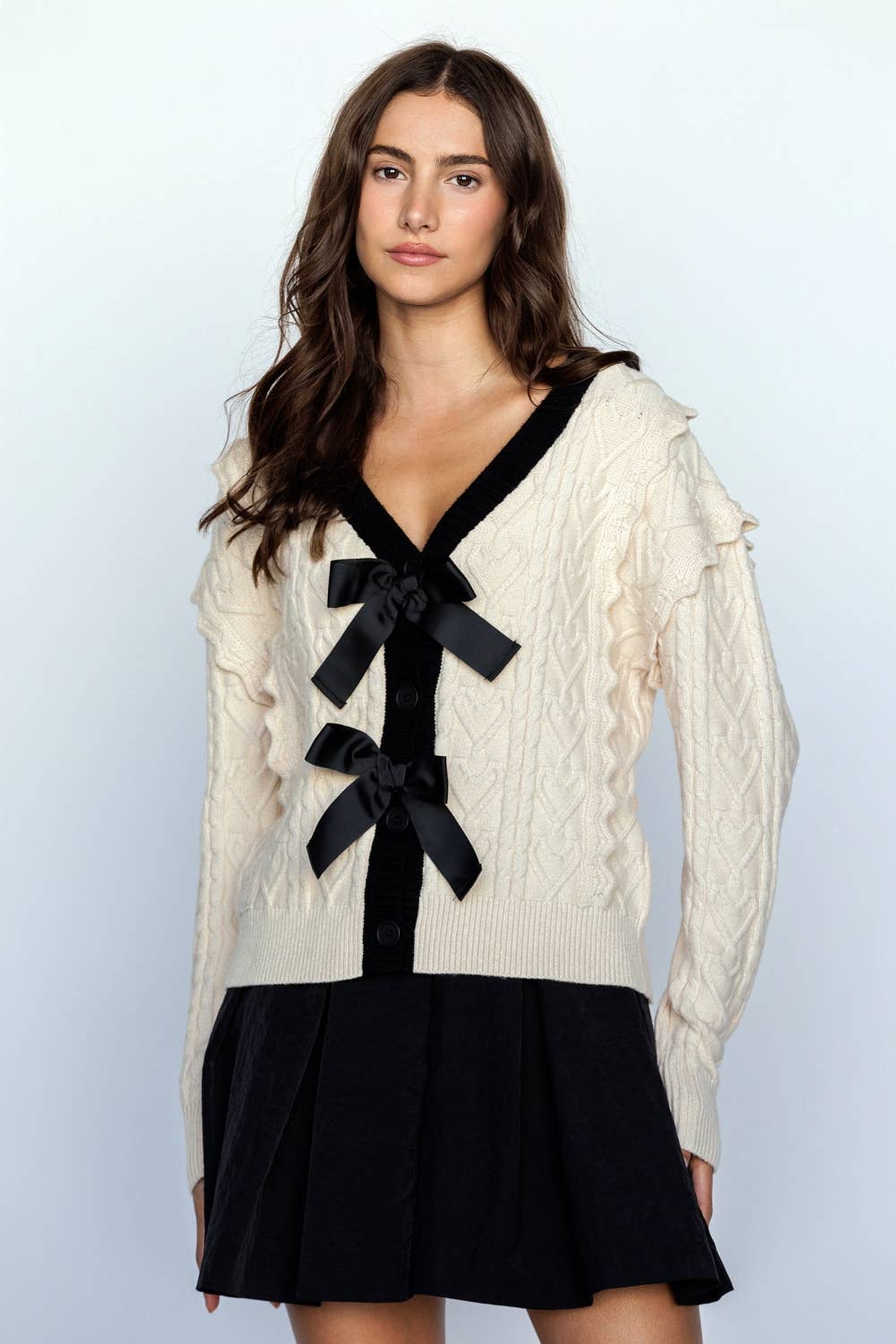 CABLE KNIT CARDIGAN WITH BOWS