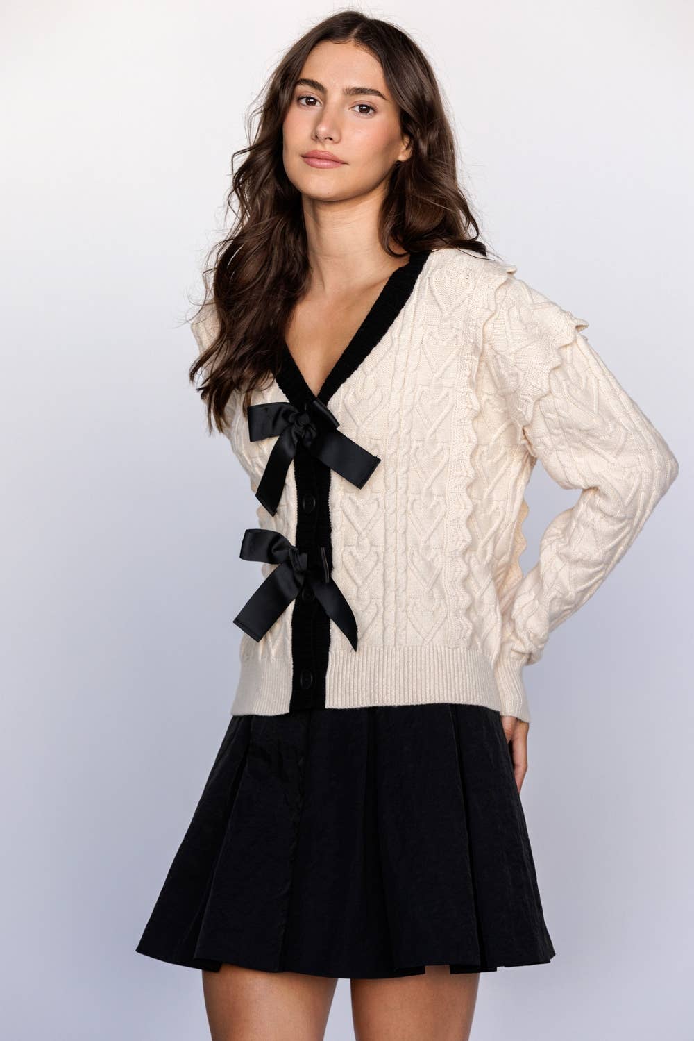 CABLE KNIT CARDIGAN WITH BOWS